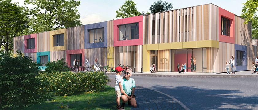 Moderne, farbenfrohe Kindertagesstätte mit Menschen vor dem Gebäude.